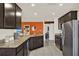 Open kitchen area with stainless steel appliances, and granite counters at 1579 Swan Lake Cir, Dundee, FL 33838