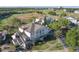 An aerial view captures this residential building near a golf course with lush landscaping around the perimeter at 1598 Heritage Crossing Ct # 302, Reunion, FL 34747