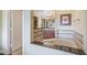 Bright bathroom featuring a granite-topped tub and tiled accents at 1598 Heritage Crossing Ct # 302, Reunion, FL 34747