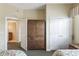 Bedroom view featuring an armoire and doorway leading to the ensuite bath at 1598 Heritage Crossing Ct # 302, Reunion, FL 34747