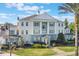 Beautiful building featuring distinct architectural style, well-maintained landscaping, and a welcoming entrance at 1598 Heritage Crossing Ct # 302, Reunion, FL 34747