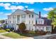 Attractive building boasting classic architectural details, surrounded by lush greenery and manicured lawns at 1598 Heritage Crossing Ct # 302, Reunion, FL 34747