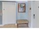 Hallway featuring an elevator, bench seating, art, and access to Unit 302 at 1598 Heritage Crossing Ct # 302, Reunion, FL 34747