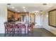 Kitchen with a stainless refrigerator, granite counters, and bar seating at 1598 Heritage Crossing Ct # 302, Reunion, FL 34747