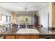 Bright, open-concept living space showcasing a stylish kitchen island and balcony access at 1598 Heritage Crossing Ct # 302, Reunion, FL 34747