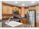 Well-equipped kitchen featuring modern appliances, granite countertops, and ample cabinet space for storage at 1598 Heritage Crossing Ct # 302, Reunion, FL 34747