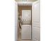 Convenient laundry closet with stacked washer and dryer unit at 1598 Heritage Crossing Ct # 302, Reunion, FL 34747