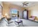 Cozy living room with balcony access, perfect for enjoying natural light and tranquil views at 1598 Heritage Crossing Ct # 302, Reunion, FL 34747