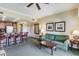 Comfortable living space boasting stylish decor, inviting furniture, and seamless flow into the kitchen area at 1598 Heritage Crossing Ct # 302, Reunion, FL 34747