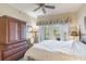 The main bedroom features a ceiling fan and closet space at 1598 Heritage Crossing Ct # 302, Reunion, FL 34747