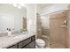 Bright bathroom with granite counters, shower stall and modern fixtures at 1639 Lima W Ave, Kissimmee, FL 34747