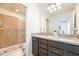 Bright bathroom featuring granite countertops, double vanity, and glass shower at 1639 Lima W Ave, Kissimmee, FL 34747