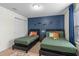 Charming bedroom featuring twin beds and mural at 1639 Lima W Ave, Kissimmee, FL 34747