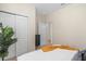 Neutral bedroom featuring closet, dresser, carpet, and white linens at 1639 Lima W Ave, Kissimmee, FL 34747