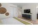 Bedroom with a TV above a chest of drawers, and a view of a hallway at 1639 Lima W Ave, Kissimmee, FL 34747