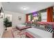 Stylish bedroom with twin beds, playful tropical accents, and an en-suite bathroom at 1639 Lima W Ave, Kissimmee, FL 34747