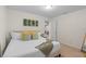 Bedroom with three mounted succulent planters, a large window, and neutral decor at 1639 Lima W Ave, Kissimmee, FL 34747