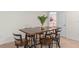 Cozy dining area features a modern high-top table with stylish chairs and an eye-catching centerpiece at 1639 Lima W Ave, Kissimmee, FL 34747