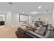 Spacious living room with large media screen and comfortable seating; ideal for movie nights at 1639 Lima W Ave, Kissimmee, FL 34747