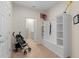 Well-organized mudroom with storage, seating, and access to the laundry room at 1639 Lima W Ave, Kissimmee, FL 34747