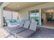 Relaxing patio with comfortable seating and lounge chairs with access to the interior at 1639 Lima W Ave, Kissimmee, FL 34747