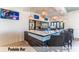 Upscale poolside bar with ample seating and stylish lighting, creating an inviting atmosphere at 1639 Lima W Ave, Kissimmee, FL 34747