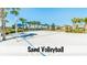 Recreational sand volleyball court surrounded by palm trees and landscaping on a sunny day at 1639 Lima W Ave, Kissimmee, FL 34747