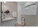 Bathroom showcasing a white tiled shower with a window, granite countertop, and neutral decor at 1806 Paloma Ave, Sanford, FL 32771