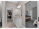 Bathroom featuring a granite countertop vanity, walk-in closet, and access to the bedroom at 1806 Paloma Ave, Sanford, FL 32771