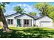 Beautifully landscaped front yard with lush green grass and attractive exterior; a welcoming curb appeal at 1806 Paloma Ave, Sanford, FL 32771