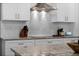 Modern kitchen featuring sleek stainless steel appliances, stylish countertops, and white subway tile backsplash at 1806 Paloma Ave, Sanford, FL 32771