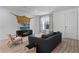 Cozy living room with modern furniture, a large window, and stylish decor at 1806 Paloma Ave, Sanford, FL 32771