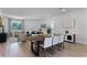 Open concept living and dining area with modern furnishings, a dining table, and bright natural light at 1806 Paloma Ave, Sanford, FL 32771