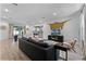 Spacious living room with a view into the dining area and kitchen, creating an open and inviting space at 1806 Paloma Ave, Sanford, FL 32771