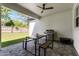 Inviting patio with a grill, seating and ceiling fan perfect for outdoor dining and entertaining at 1806 Paloma Ave, Sanford, FL 32771