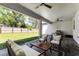 Covered patio with cozy seating and a ceiling fan, perfect for enjoying the outdoors at 1806 Paloma Ave, Sanford, FL 32771