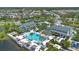 Aerial view of community clubhouse featuring a resort-style pool, lounging areas, and meticulously landscaped grounds at 2011 Soaring Oak Way, Winter Park, FL 32792