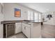Features a wet bar with modern cabinets, countertop and beverage cooler, perfect for entertaining guests and hosting fun gatherings at 2011 Soaring Oak Way, Winter Park, FL 32792