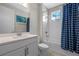 Bathroom with a shower-tub combo, single sink vanity, and nautical-themed accents at 2011 Soaring Oak Way, Winter Park, FL 32792