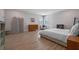 Bedroom with a king bed, wood floors and natural light from a window at 2011 Soaring Oak Way, Winter Park, FL 32792