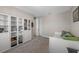Cozy carpeted bedroom with white built-in shelving and good natural light at 2011 Soaring Oak Way, Winter Park, FL 32792