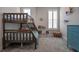 Bedroom featuring a bunk bed, blue dresser, and shuttered window at 2011 Soaring Oak Way, Winter Park, FL 32792