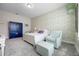 Charming bedroom featuring a patterned wall, blue armoire, white furniture, and overhead lighting at 2011 Soaring Oak Way, Winter Park, FL 32792