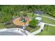 Aerial view of a community playground featuring a play structure, picnic shelter, and walking path at 2011 Soaring Oak Way, Winter Park, FL 32792