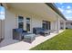 Cozy covered patio with comfortable seating, ideal for relaxing and enjoying the outdoors at 2011 Soaring Oak Way, Winter Park, FL 32792