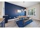 Elegant dining room with stylish lighting, dark accent wall, and natural light at 2011 Soaring Oak Way, Winter Park, FL 32792