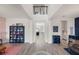 Inviting entryway with wood floors that leads to a spacious living and dining area at 2011 Soaring Oak Way, Winter Park, FL 32792