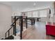 Spacious game room featuring a pool table, shuffleboard, and stylish staircase at 2011 Soaring Oak Way, Winter Park, FL 32792