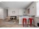 Game room featuring a wet bar, work table and stylish red stools at 2011 Soaring Oak Way, Winter Park, FL 32792