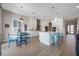 Bright, modern kitchen and dining area featuring stainless appliances and breakfast bar at 2011 Soaring Oak Way, Winter Park, FL 32792